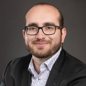 Professional headshot of Moe Zeidan.